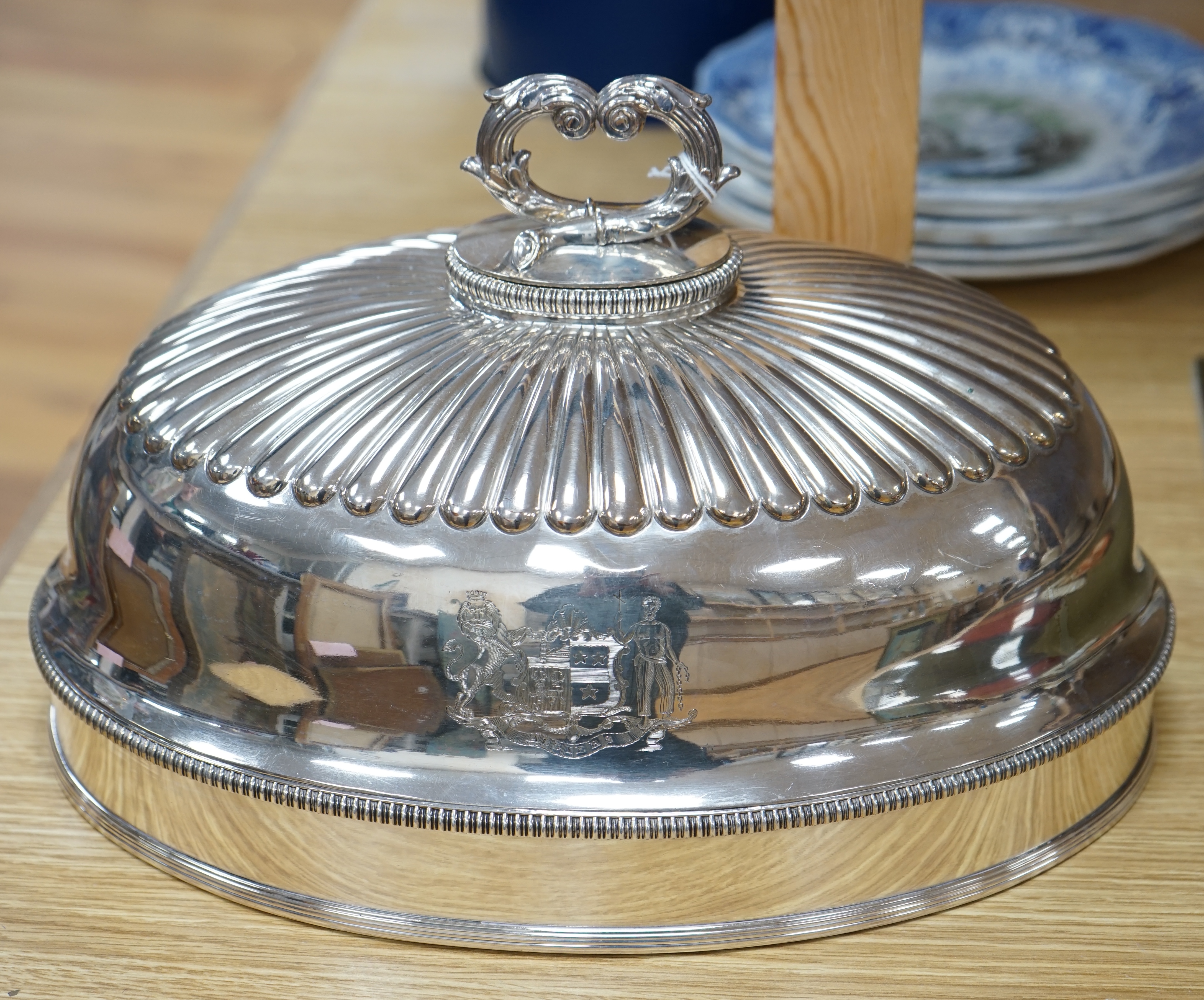 A 19th century Old Sheffield plate oval meat dish cover, with handle, 32.5cm long. Condition - good